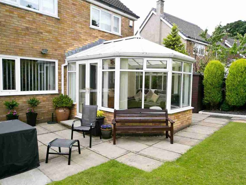 A modern white Victorian conservatory for a home in Dorset.