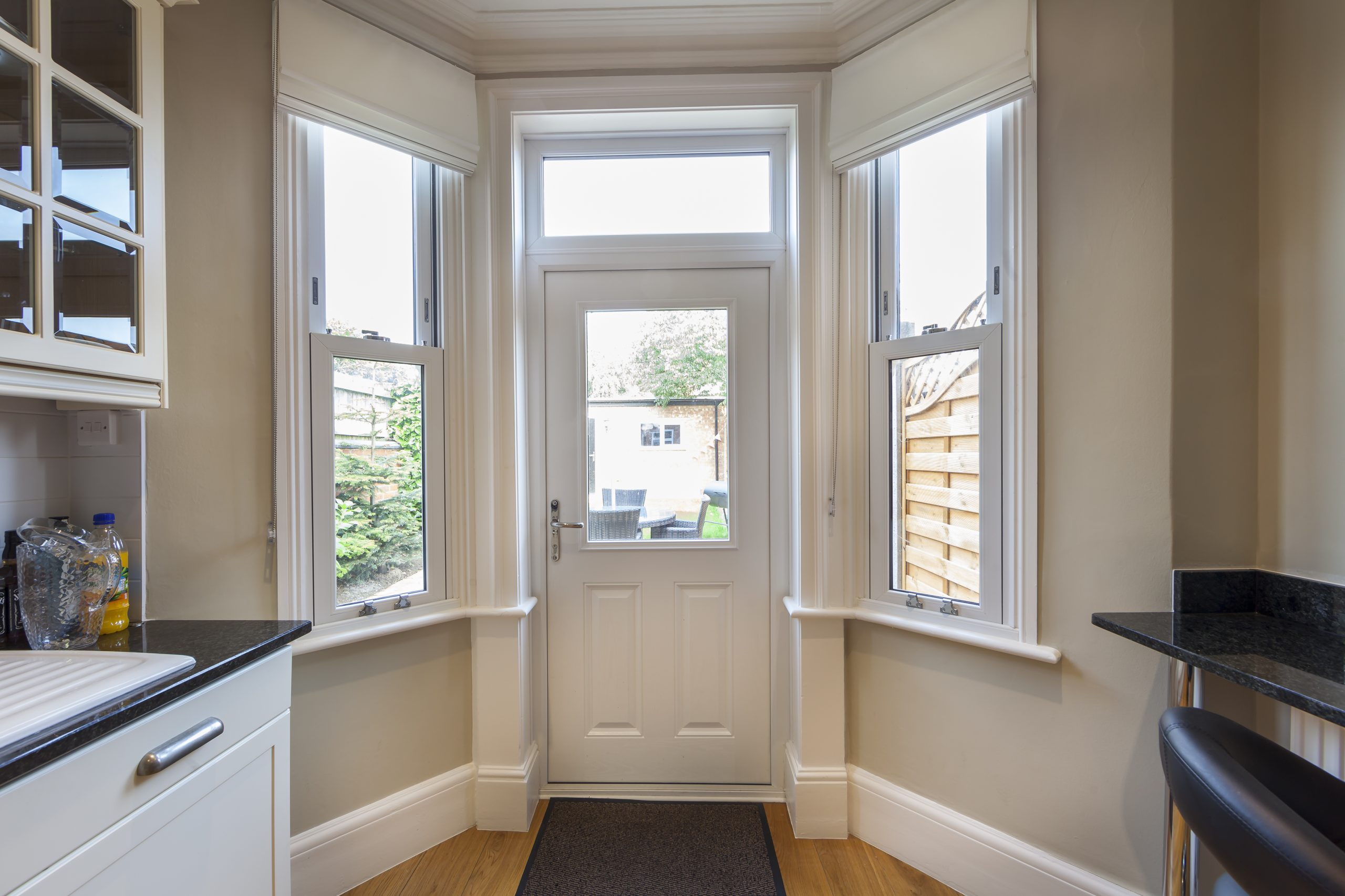 bespoke white door with chrome handle