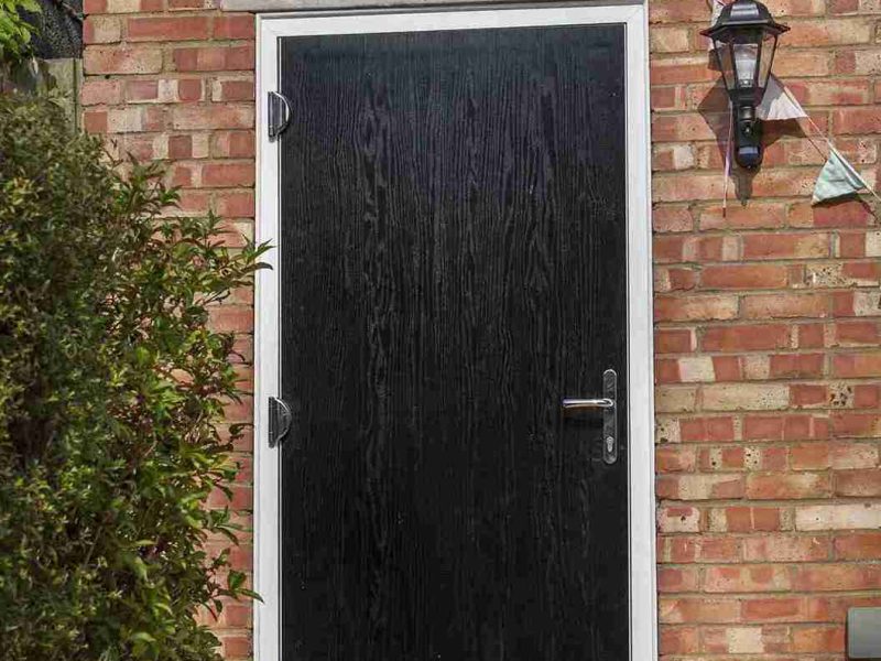 black composite door with chrome handle