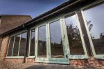 Green patio doors for a home in Bournemouth.