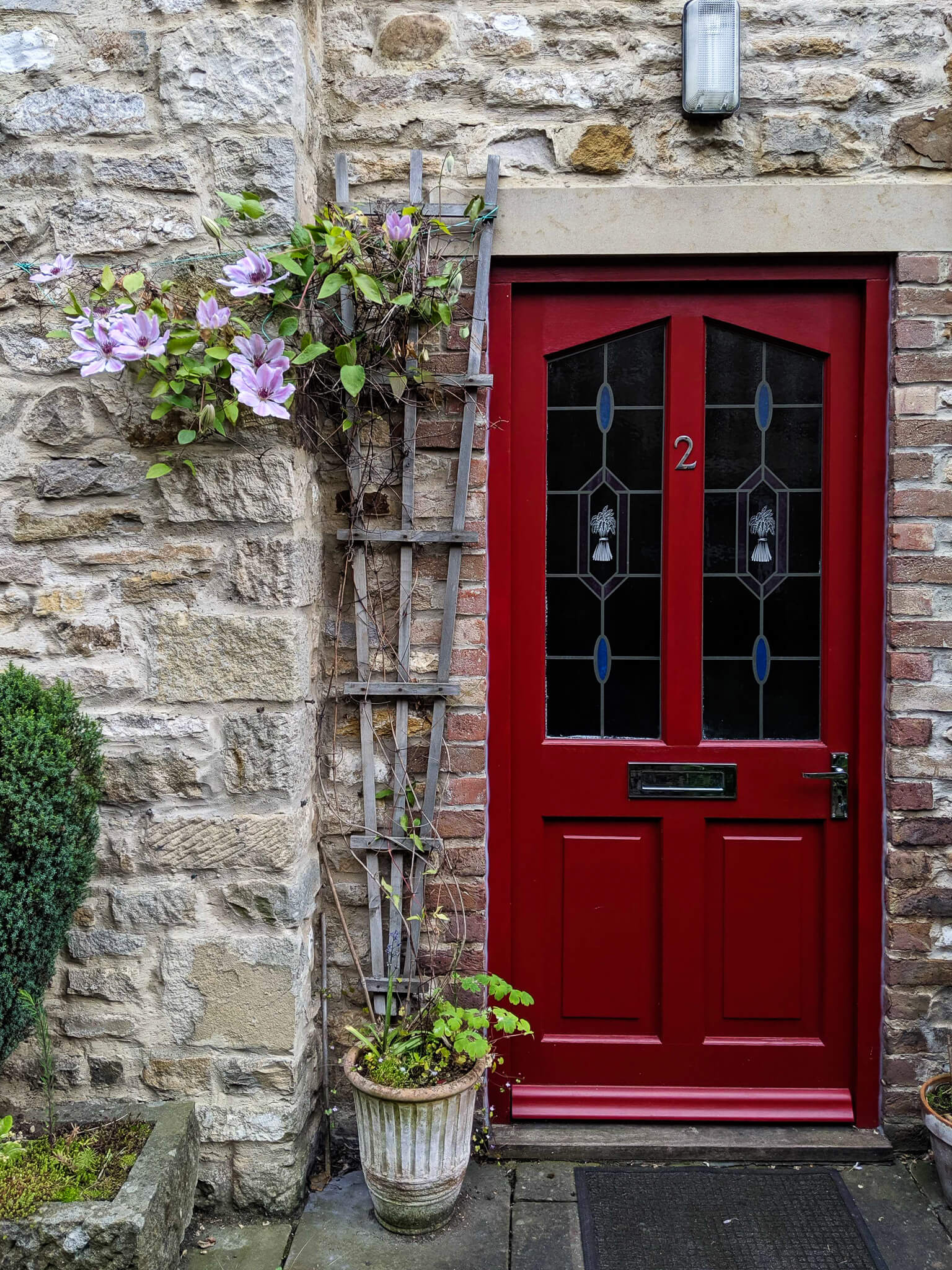 A red composite front door in Bournemouth