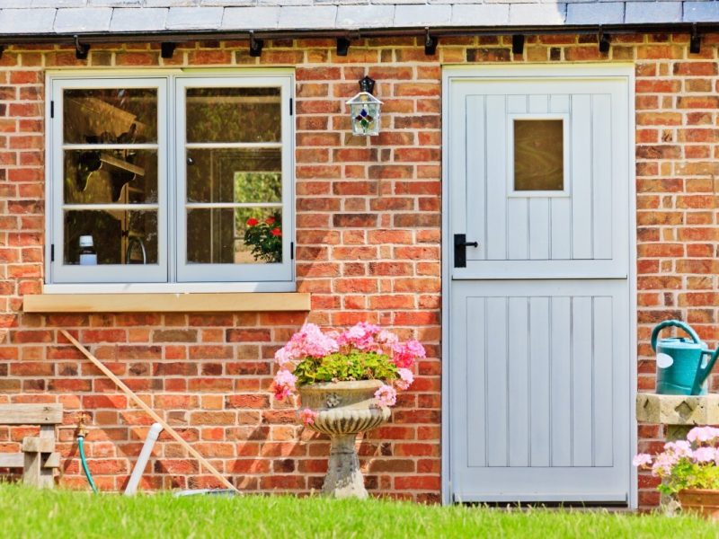Green stable doors for a home in Bournemouth.