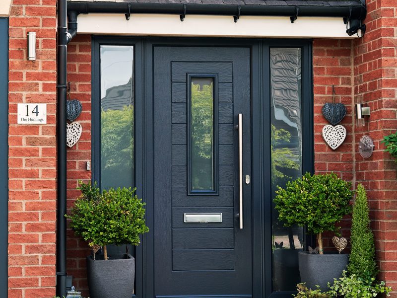 A light blue composite door for a home in Dorset.
